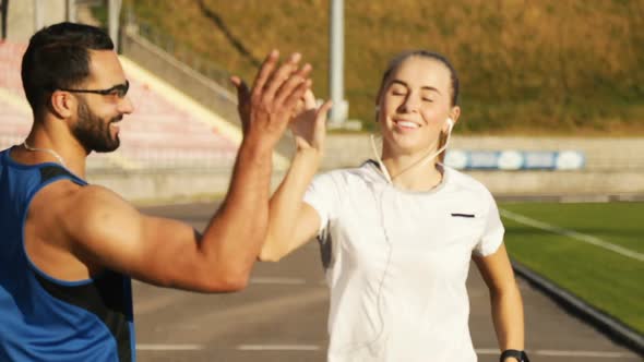 Girl Gives High Five To Trainer