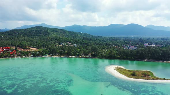 Daytime birds eye clean view of a white sandy paradise beach and blue sea background in high resolut