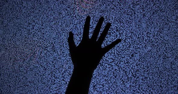 Hand Touching White Noise Screen