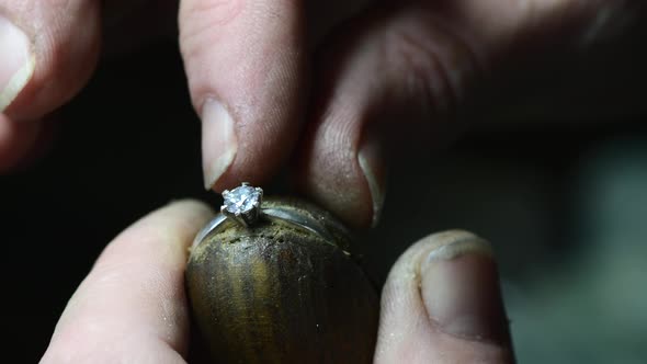 Closeup of Wedding Ring Polishing By Caicasian Jeweler Isolated  Footage