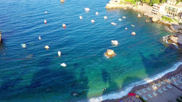 Bird's eye view of the beautiful Sicilian beach and Mediterranean Sea filled with tiny ships. Mazzar