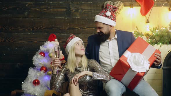 Xmas Couple, Cheerful Man and Woman Opens Christmas Gift