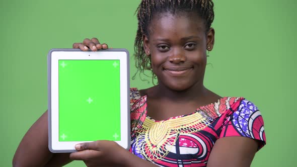 Young African Woman Showing Digital Tablet