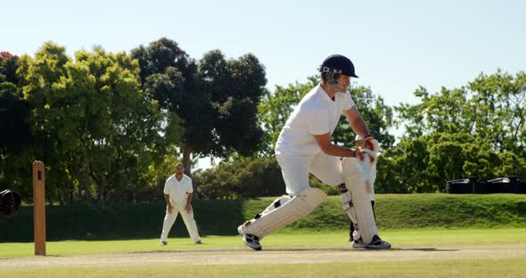 Batsman hitting a ball during cricket match