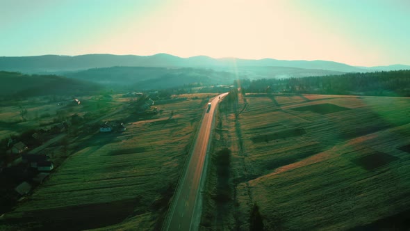 Top View on Highway with Driving Cars Mountains Scene