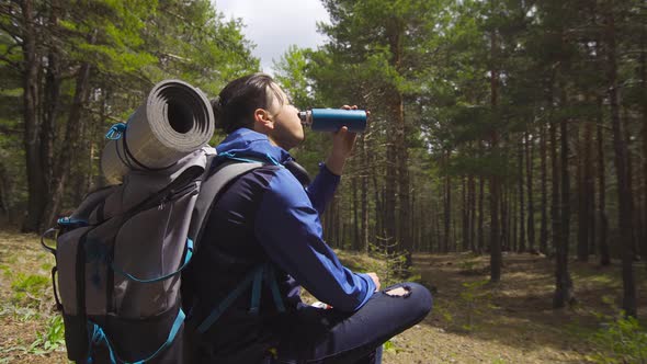 Hiking, young man resting.