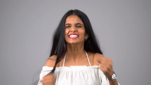 Happy Indian girl cheering