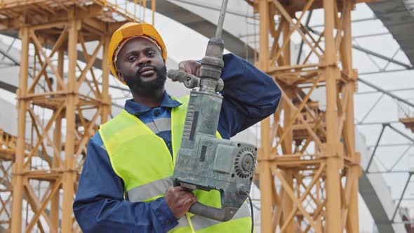 Portrait of African-American Construction Worker with Jackhammer