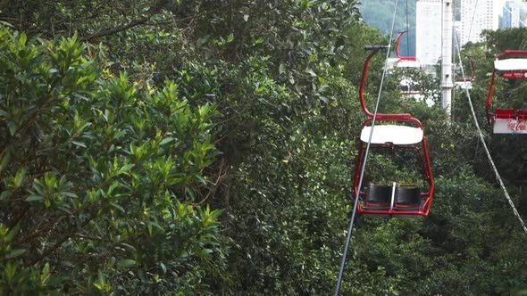 Focus maintenance to an empty red cable car seat in operation. Entertainment