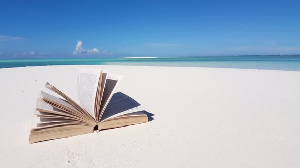 Wide angle fly over island view of a sunshine white sandy paradise beach and aqua turquoise water ba