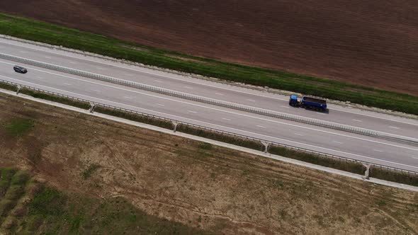 Aerial View of a Suburban Auto Track with Few Moving Cars