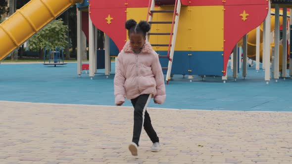 African American Baby Playing in Playground After School Little Girl Lonely Jumping Outdoors Kid in