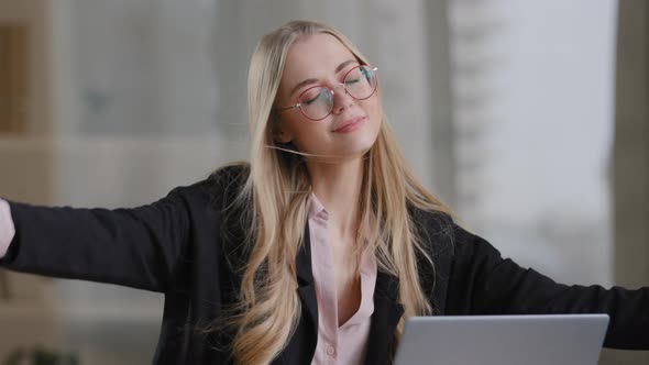 Caucasian Girl Worker User Secretary Business Woman in Glasses Sits with Closed Eyes at Table with