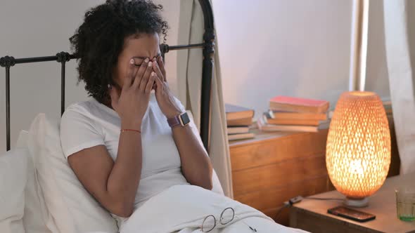 Upset Young African Woman Crying in Bed 