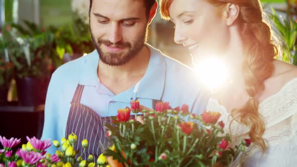 Close-up of florists checking flower