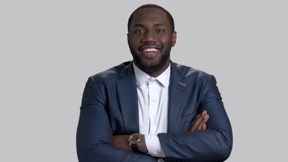 Smiling Afro-american Businessman with Arms Crossed.