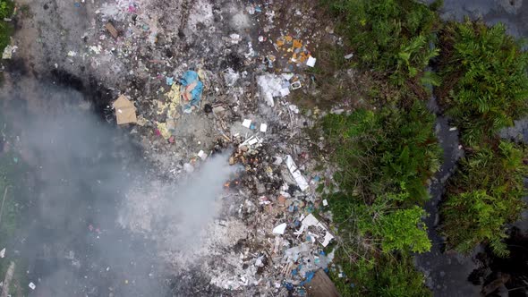 Air pollution due to open burn garbage