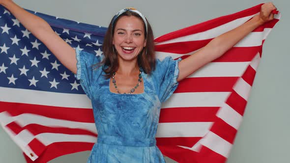 Lovely Young Woman Waving and Wrapping in American USA Flag Celebrating Human Rights and Freedoms