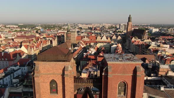 Flying over the bridge on St. Mary Magdalene Church in Wroc_aw, Poland