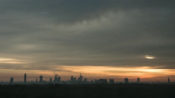 Timelapse of Sun Rising in Overcast Sky Over the City