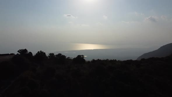 Drone Aerial Shot Of Lush Green Mountains To Clear Blue Sea. Bokor Mountains, Cambodia