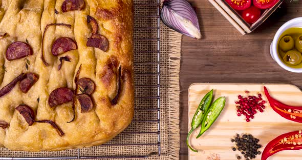 Traditional Italian Focaccia with pepperoni, cherry tomatoes, black olives, rosemary ando onion - ho