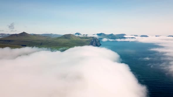 Aerial View of a Slave Cliff Hidden in the Mist Faroe Islands