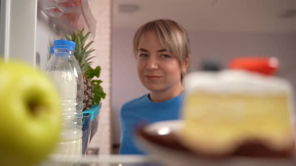 Healthy Eating Female Taking Apple From Fridge