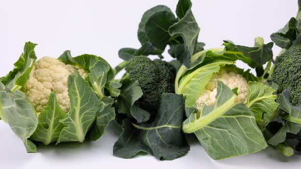 Organic Broccoli and Cauliflours on White