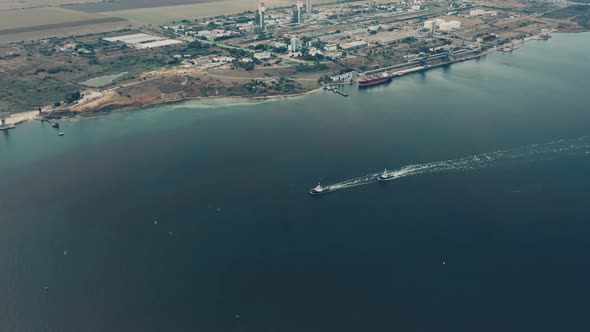 Aerial Drone View of Tugboats Going Across the Bay