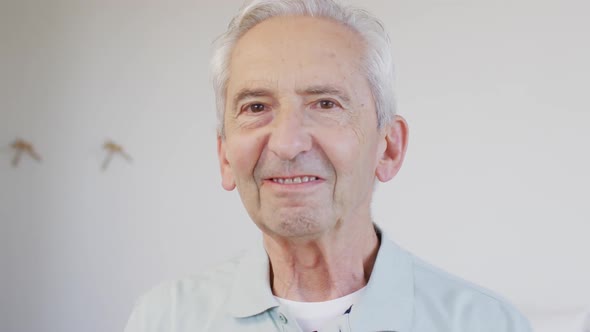 Animation of happy caucasian senior man looking at camera