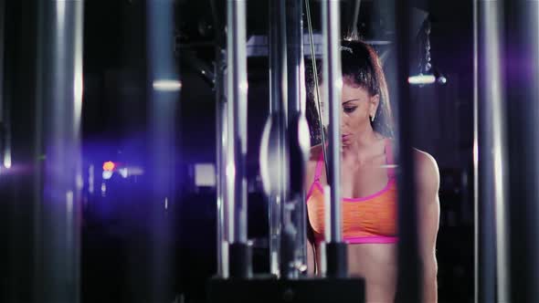 Slider Shot: Athletic Woman Trained in the Gym. Beautiful Reflections in the Frame. Female