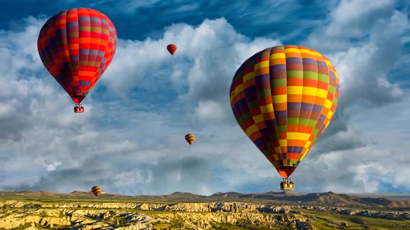 Cinemagraph of hot air balloons rising over the Cappadocia, Turkey desert amidst churning time lapse