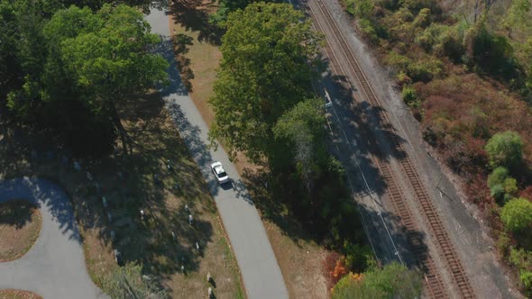 Aerial Drone Shot Tracking a Car Driving Through Mt Feake Cemetery in Waltham MA