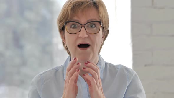 Portrait of Happy Amazed Old Businesswoman Surprise