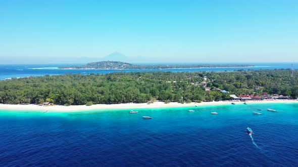 Boats surrounding paradise tropical island. preserved nature, white sandy beach and luxury resorts.