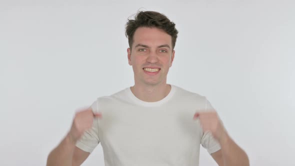 Successful Young Man Celebrating on White Background