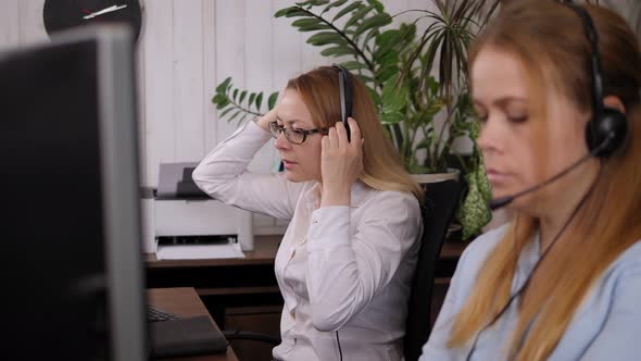 Business Woman Starts Working in a Technical Support Office She Puts on Headset