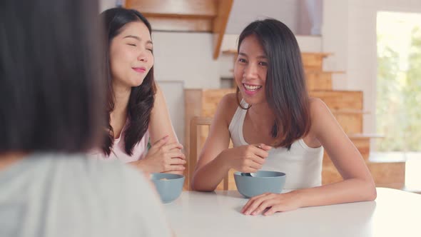 Asian women have breakfast at home.