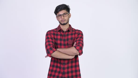 Young Handsome Bearded Indian Hipster Man with Arms Crossed