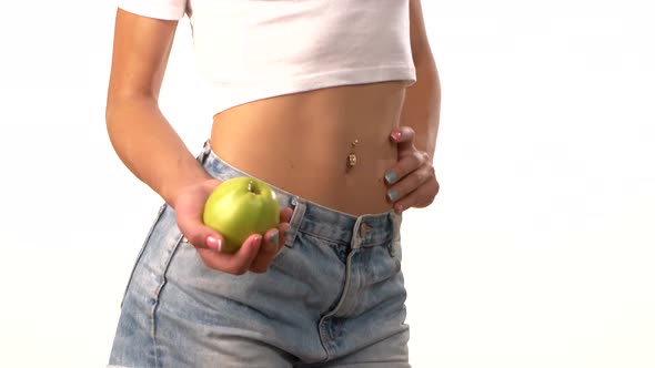 Slim Woman with Apple in Her Hand, on White Background