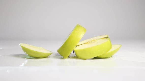 Sliced Apple Fall Down on White Surface
