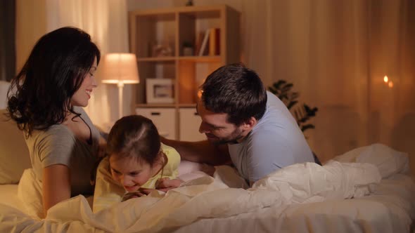 Happy Family Having Fun in Bed at Home 20