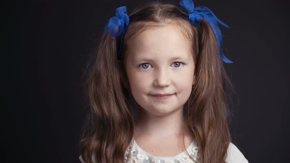 Footage Portrait Pretty Young Girl on Dark Background