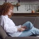 Side View of Happy Redhaired Woman with Curly Hair Talking Using Laptop Taking Via Online Virtual - VideoHive Item for Sale