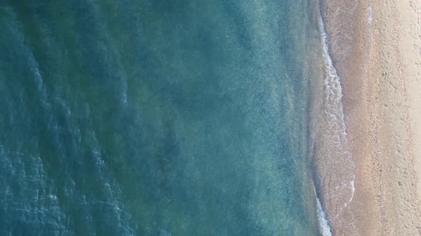 Blue clear water and white sand top view of the sea