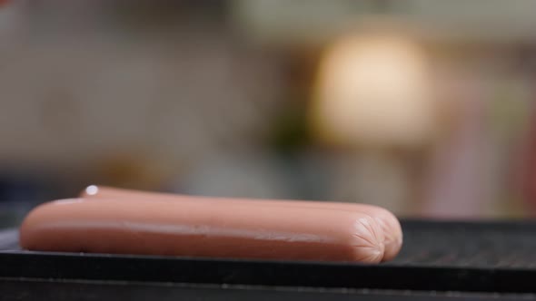 Meat Sausages Are Fried On Grill