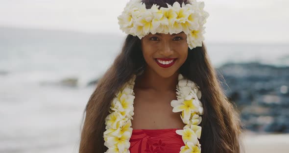 Woman performing Hawaiian hula on the beach