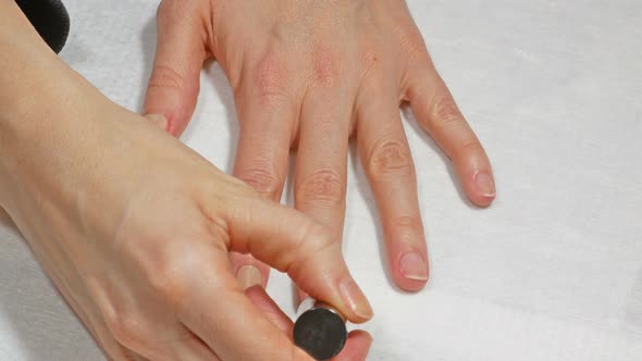 Application of Base to The Nails of The Left Hand