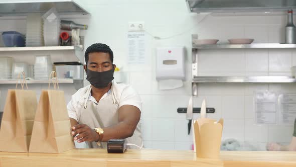 Cafe Worker Is Concentrated on Preparing Orders